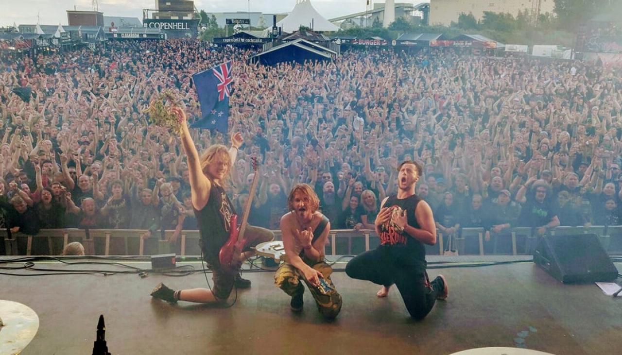 Thousands of Danish heavy metal fans perform haka for Kiwi group Alien Weaponry | Newshub