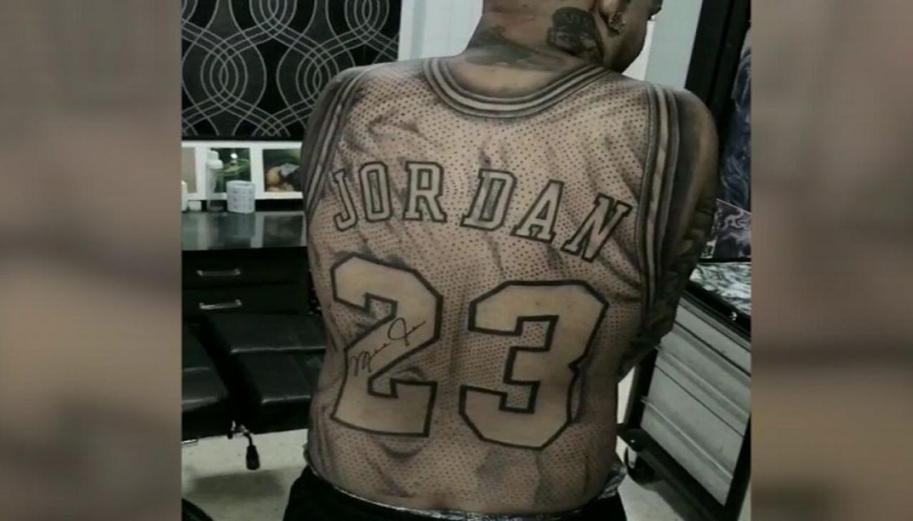 Fan has Michael Jordan jersey tattooed across his back.