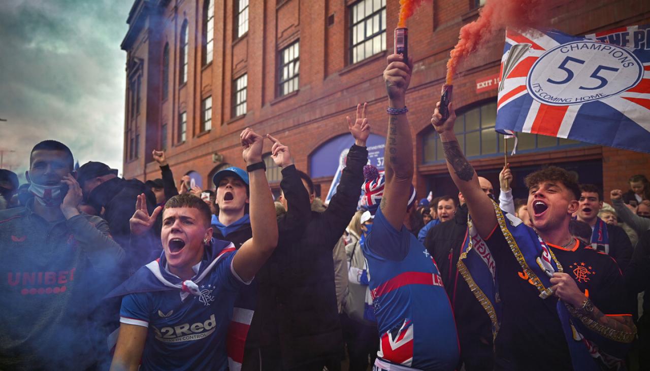 Fans packed the streets around Glasgow's Ibrox Stadium to celebrate Ra...