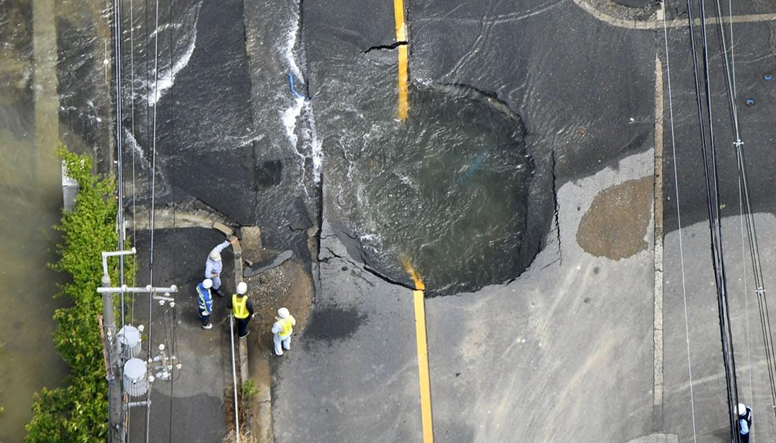 A road in Osaka damaged by the magnitude-6.1 earthquake on Monday. 