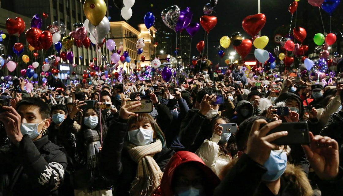 Jubilant crowds pack streets in China's pandemic-hit Wuhan to ring in 2021  | Newshub